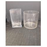 (2) clear glass vases one vase is 7in tall x 4in