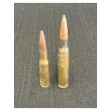 2 empty brass cartridges, 4.5 & 5.5in long