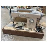 White sewing machine in case
