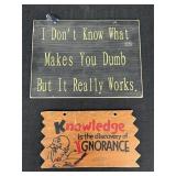 2 wooden signs about intelligence