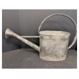 Oval metal watering can