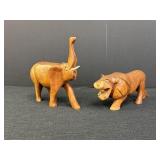 Hand-carved African wooden elephant & lion,