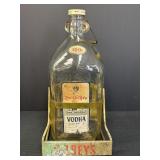 100 OsoNegro Vodka bottle in metal pouring cradle,