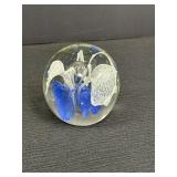 Art glass paperweight sphere w/blue & white flower