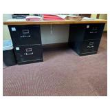 2 black filing cabinets w/ desk top