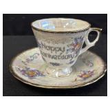 Iridescent porcelain "anniversary" teacup & saucer
