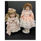 (2) Porcelain Dolls w/ satin & lace dresses