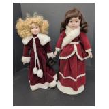 (2) Red velvet dressed dolls w/ porcelain faces &