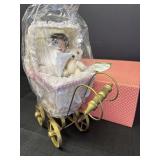 Paradise Galleries porcelain baby Sara & pram, NIB