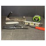 Variety of hand tools - tape measure, level,