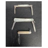 (3) Knives one metal case 2 celluloid cases