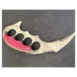 Karambit-style knife, skinner or trench knife, has