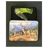 Collectible wildlife deer pocket knife in scenic
