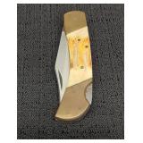 Stainless folding pocket knife, celluloid & brass