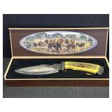 Elephant Bowie knife w/ etched design and carved