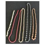 Assorted bead necklaces, pinks, cream, silver -