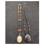 (2) Beaded Necklaces w/ Pendants one marked 1928