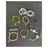 Variety of beaded & stone bracelets - many
