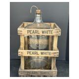 5-gallon glass water carboy housed in wooden