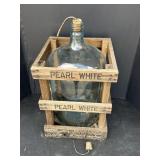 5-gallon glass water carboy housed in wooden