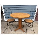 Oak round pedestal table w/2 ice cream chairs