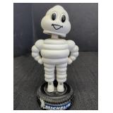 Bobblehead Michelin Man standing on tire