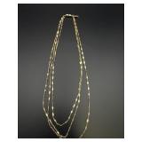 1928 3 strand gold toned necklace