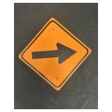 orange diamond-shaped directional traffic sign