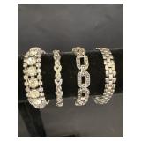 4 silver-tone costume jewelry bracelets, 3 have