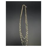 1928 3 strand gold toned necklace