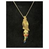 Gold-tone parrot pendant necklace w/intricate