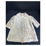 Childï¿½s cream fur coat