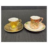 2 demitasse cup & saucer sets.  One is mostly gold