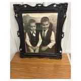 Black ornate framed portrait
