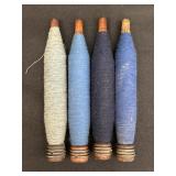 4 vtg wooden textile bobbins w/ blue tone fibers