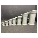 Heavy pewter measuring tankards, set of 7, for