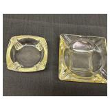 2 pale yellow glass ashtrays.  4.5in & 6in square.