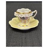 Yellow luster demitasse cup & saucer set w/raised