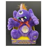 Plush purple people eater, sings & moves.  12in.