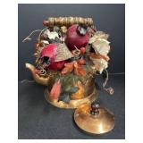 Metal Teapot filled with artificial flowers