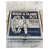 Stainless steel Make-A-Clamp kit in box (partial)