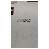 Three 10 karat gold rings with gemstones
