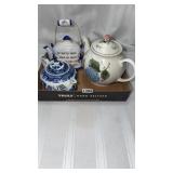 2 teapots and a wall hanging, one princess house
