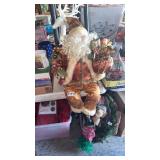 SITTING SANTA AND REINDEER