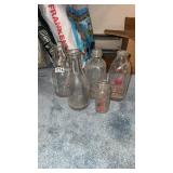 Milk bottles and one cream top