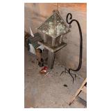 Four birdfeeders and a shepherd hook