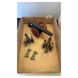 3 cannons and 2 figurines