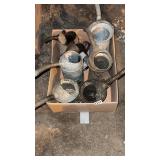 Box of oil cans