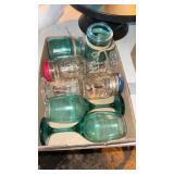 Two boxes, wine, glasses, and jars