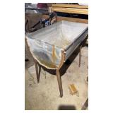 Stainless steel tub with iron legs